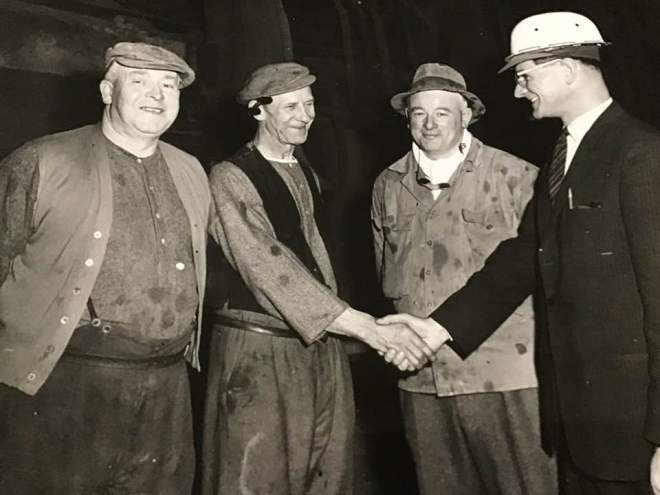 Ron Crocker,Bob Wilson,and shift manager Bob Purvis being congratulated by Mr E Amos,Steel Plant Superintendent,for their achievement on Saturday May 6th 1961.